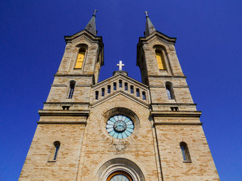 Low angle view of church against clear blue sky