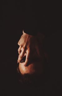 Close-up of young woman hand in darkroom