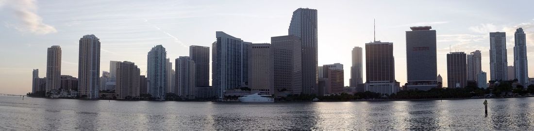 Skyscrapers in city at dusk