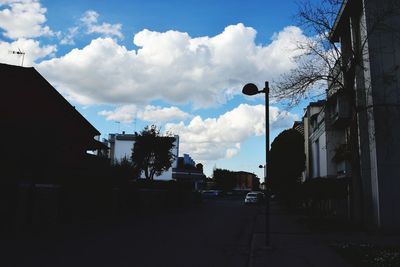 Street amidst buildings against sky