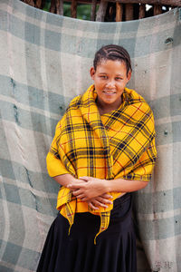 Portrait of smiling boy standing outdoors