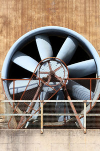 Close-up of wheel against wall