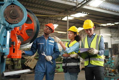 Portrait of male worker standing in the heavy industry manufacturing factory.