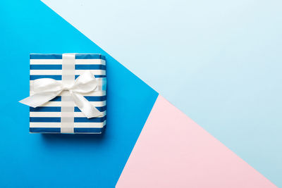 Close-up of gift box on blue background