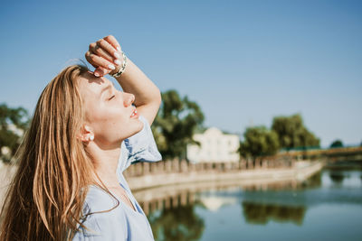 Portrait of woman against sky