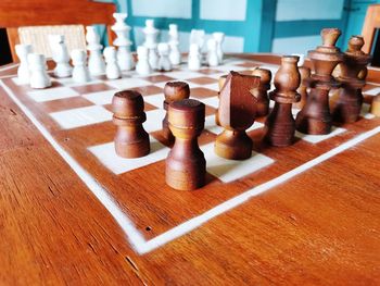 Close-up of chess pieces on table