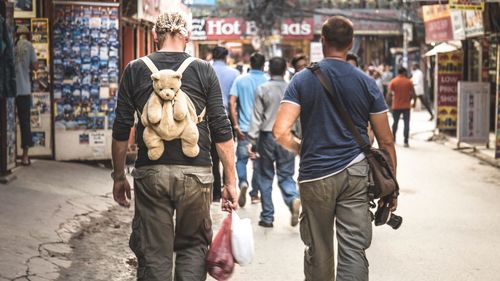 Rear view of man standing on street
