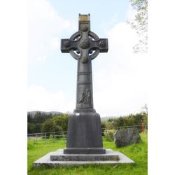 Cross on cemetery against sky