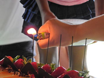 Midsection of man preparing food