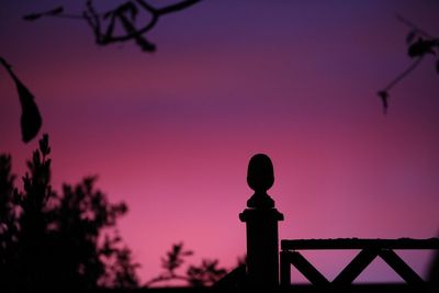 Silhouette street light against sky during sunset