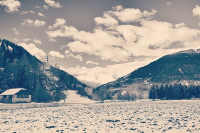 Scenic view of snowcapped mountains against sky during winter