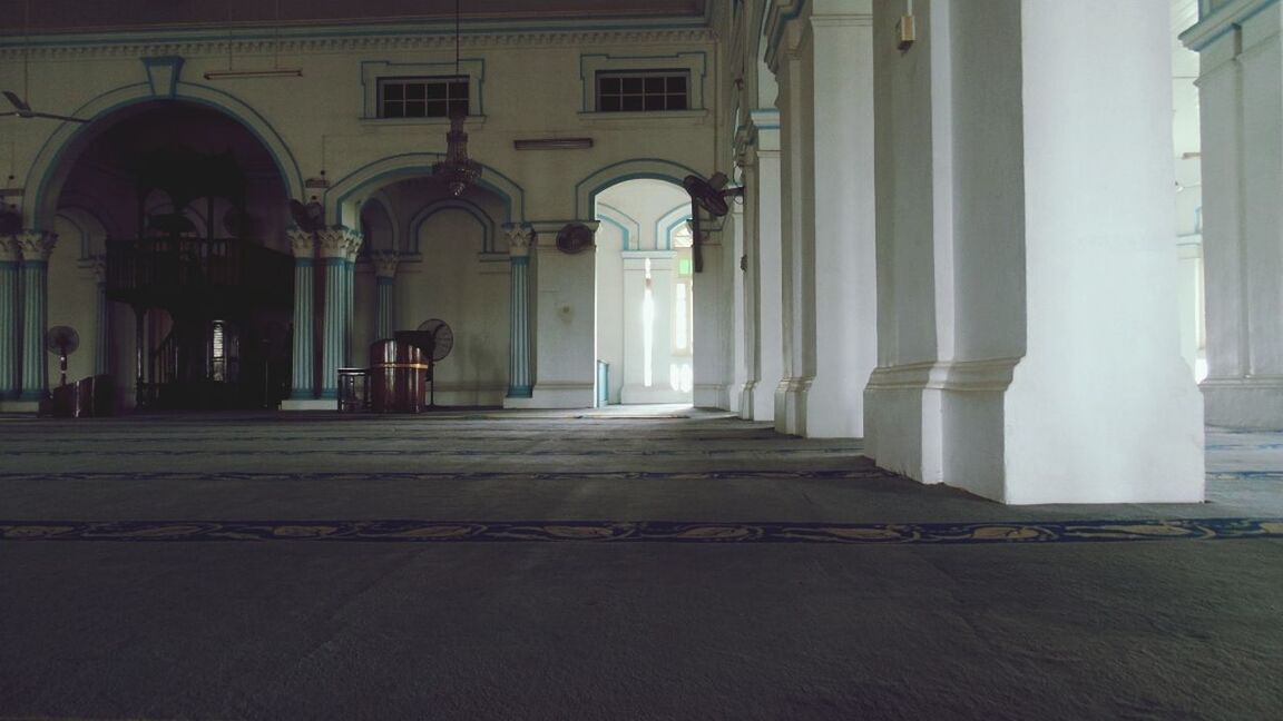 architecture, built structure, arch, building exterior, door, architectural column, indoors, window, entrance, building, corridor, column, empty, day, the way forward, no people, facade, flooring, religion, history