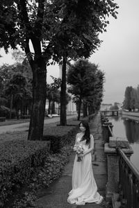 Rear view of woman standing in park