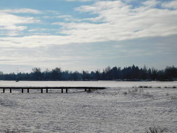 Scenic view of landscape against sky during winter