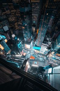 Aerial view of city lit up at night