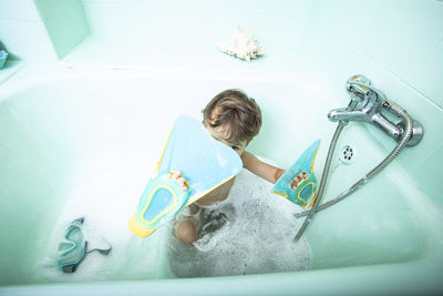 High angle view of child in bathroom at home