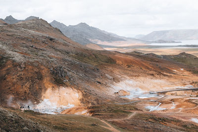 Scenic view of landscape and mountains against sky