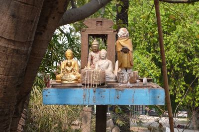 Buddha statue against trees