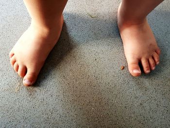 Low section of baby standing on floor