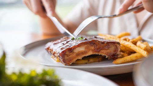 Midsection of woman holding food