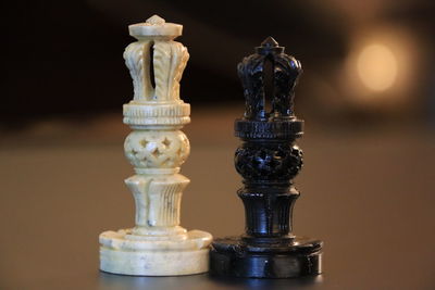 Close-up of chess pieces on table