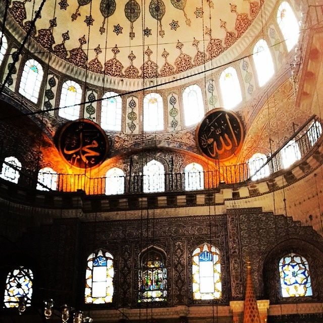 indoors, architecture, ceiling, arch, built structure, low angle view, interior, ornate, window, architectural feature, place of worship, design, religion, famous place, church, pattern, skylight, spirituality, stained glass