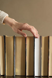 Close-up of hand holding book