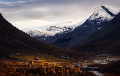 Scenic view of snow covered mountains against sky