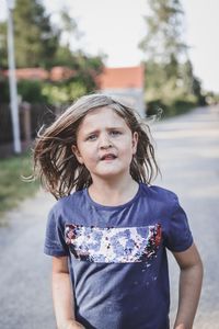 Portrait of girl standing outdoors