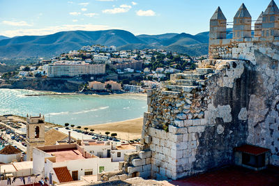 View of fort in town against sky