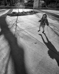 Shadow of people on road