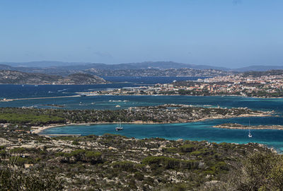 High angle view of sea and bay against sky