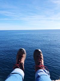 Low section of man against sea