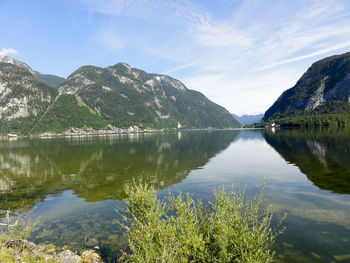 Scenic view of lake and mountains against sky
