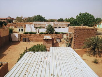 Houses in town against clear sky