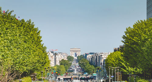 Panoramic view of trees in city against clear sky