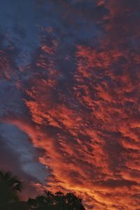 Low angle view of dramatic sky at sunset