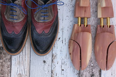 Directly above view of leather shoes on floorboard