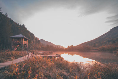 Scenic view of lake and mountains against sky