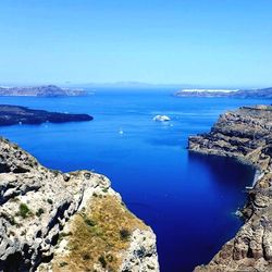 Scenic view of sea against blue sky