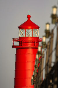 The grand haven, michigan, lighthouse bathed in the warm sunlight of a summer morning.