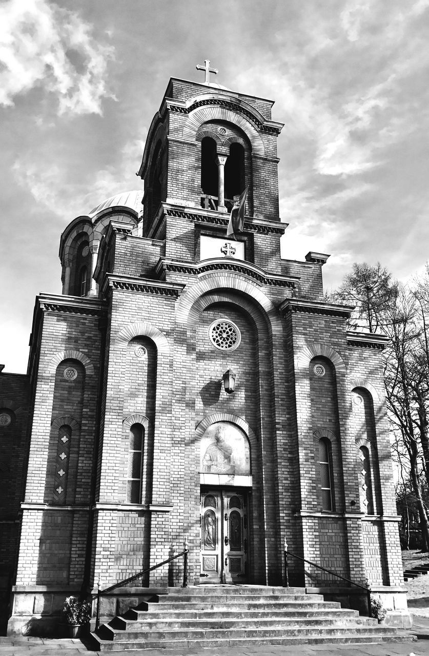 religion, architecture, built structure, spirituality, sky, place of worship, building exterior, low angle view, no people, facade, cloud - sky, outdoors, day, arch