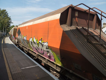 Train on railroad tracks against sky