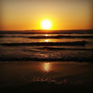 Scenic view of sea at sunset