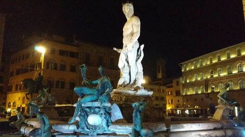 Statue of woman at night