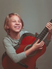 Portrait of a girl playing guitar