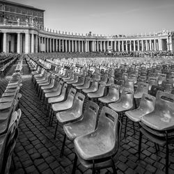 View of built structure in row, chairs and vatican 