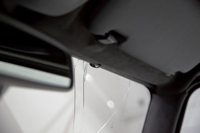 Close-up of person seen through car window