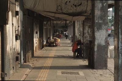 People in corridor of building