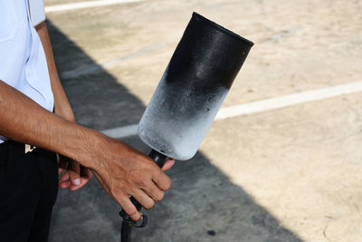 High angle view of man holding umbrella